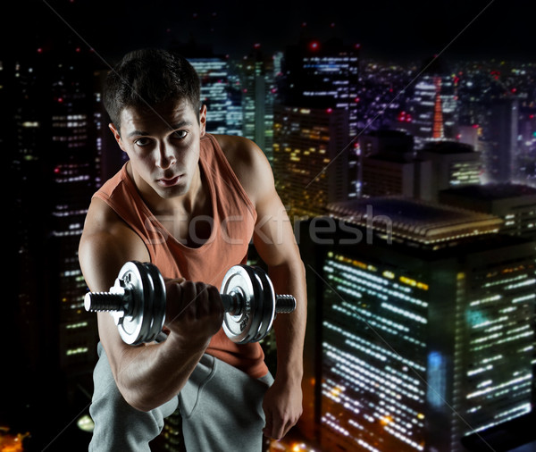 Junger Mann Hantel Bizeps Sport Bodybuilding Ausbildung Stock foto © dolgachov
