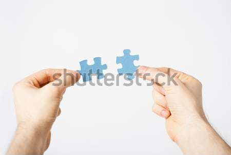 Dwa ręce móc puzzle budynku Zdjęcia stock © dolgachov