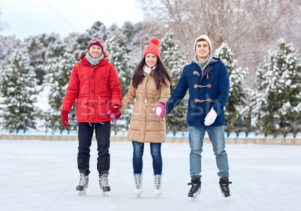 Foto stock: Feliz · amigos · patinaje · sobre · hielo · aire · libre · personas