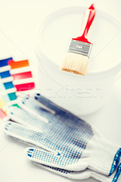 paintbrush, paint pot, gloves and pantone samples Stock photo © dolgachov