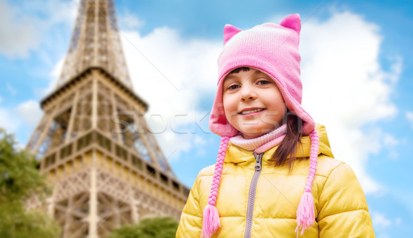 Stock photo: happy little girl over eiffel tower in paris