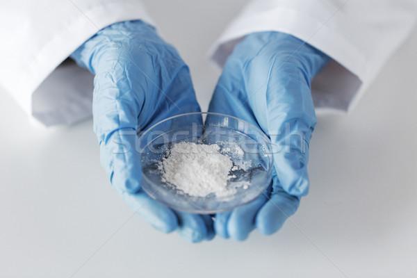 close up of scientist holding petri dish in lab Stock photo © dolgachov