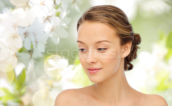 smiling young woman face and shoulders Stock photo © dolgachov