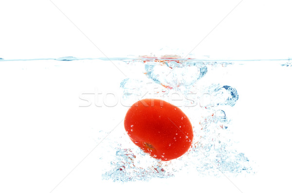 tomato falling or dipping in water with splash Stock photo © dolgachov