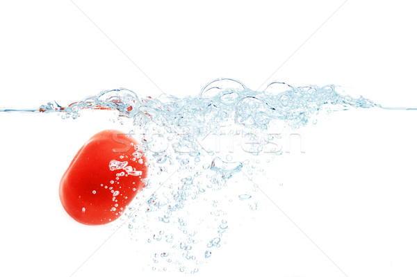 tomato falling or dipping in water with splash Stock photo © dolgachov
