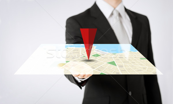 close up of man hand showing gps navigator map Stock photo © dolgachov