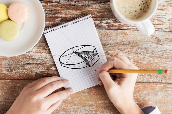 close up of hands drawing chart in notebook Stock photo © dolgachov