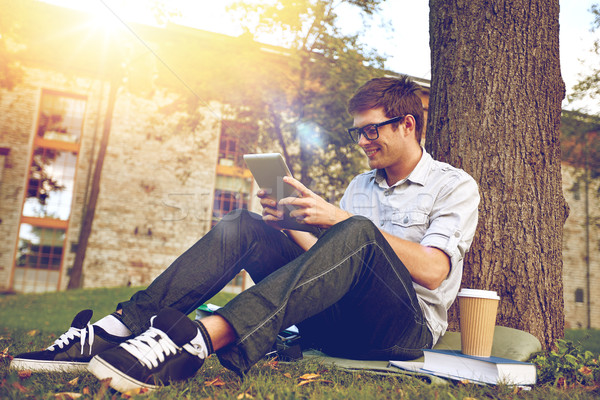 happy teenage boy with tablet pc and coffee Stock photo © dolgachov