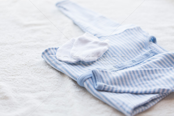 close up of baby boys clothes for newborn on table Stock photo © dolgachov