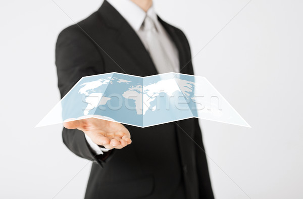 Stock photo: close up of businessman showing world map