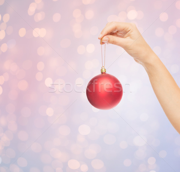 Stock photo: close up of woman in sweater with christmas ball