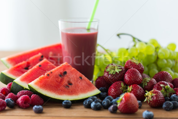 fruit and berry juice or smoothie on wooden  table Stock photo © dolgachov