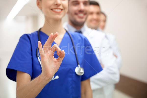 close up of doctors at hospital showing ok sign Stock photo © dolgachov