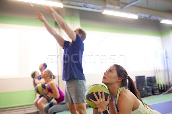group of people with medicine ball training in gym Stock photo © dolgachov