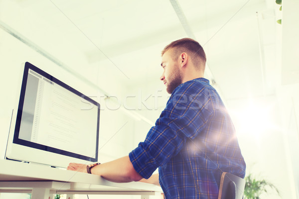 creative man or programmer with computer at office Stock photo © dolgachov