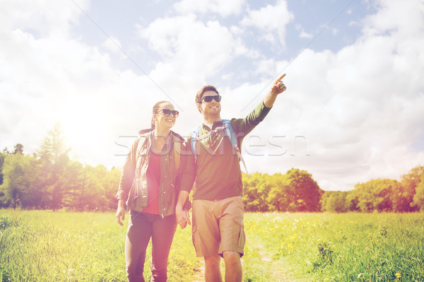 happy couple with backpacks hiking outdoors Stock photo © dolgachov