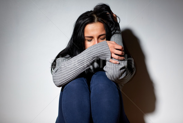 unhappy woman crying on floor Stock photo © dolgachov
