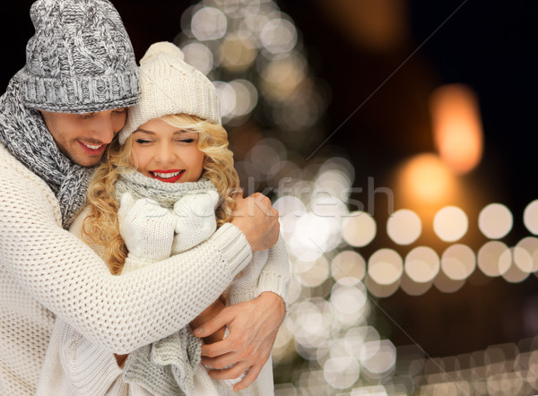 happy couple hugging over christmas lights Stock photo © dolgachov