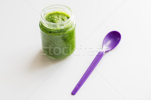 jar of vegetable puree or baby food and spoon Stock photo © dolgachov