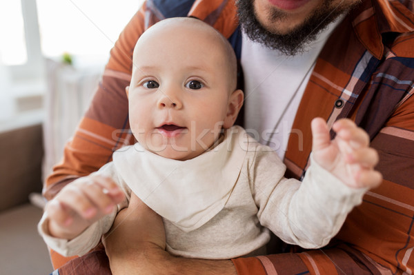 close up of happy little baby boy with father Stock photo © dolgachov