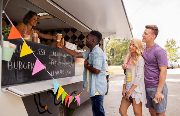 happy customers queue at food truck Stock photo © dolgachov