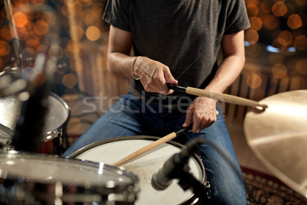 musician playing drum kit at concert over lights Stock photo © dolgachov