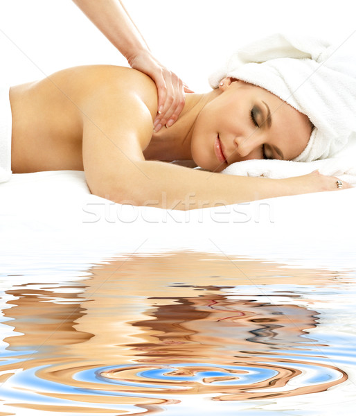 professional massage on white sand Stock photo © dolgachov