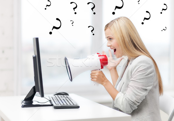 strict businesswoman shouting in megaphone Stock photo © dolgachov