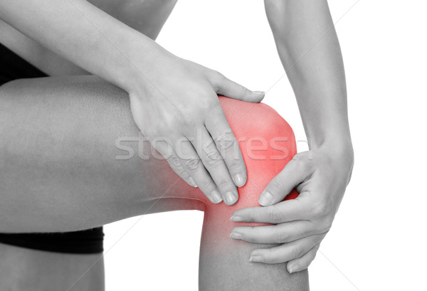 Vrouwelijke handen knie fitness Stockfoto © dolgachov