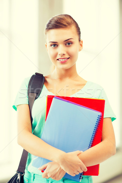 student girl with school bag and notebooks Stock photo © dolgachov