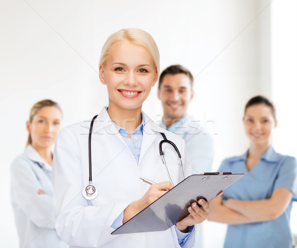 Sorridere femminile medico appunti sanitaria medicina Foto d'archivio © dolgachov
