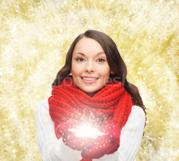 smiling woman in winter clothes with snowflake Stock photo © dolgachov