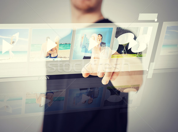 man pressing button on virtual screen Stock photo © dolgachov