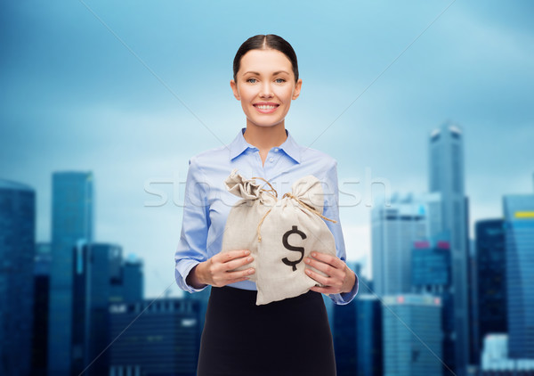 businesswoman holding money bags with euro Stock photo © dolgachov