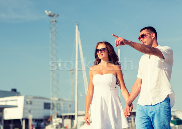 smiling couple in city Stock photo © dolgachov