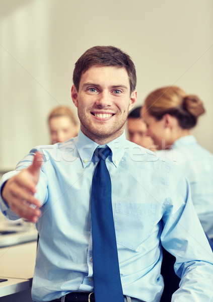[[stock_photo]]: Groupe · souriant · gens · d'affaires · réunion · bureau · gens · d'affaires