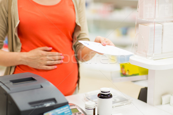 Kobieta w ciąży zakupu lek apteki ciąży muzyka Zdjęcia stock © dolgachov