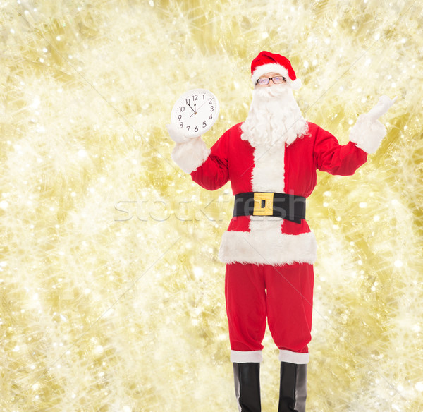 Stock photo: man in costume of santa claus with clock