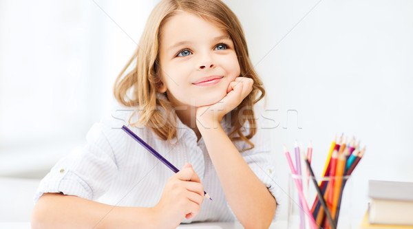 girl drawing with pencils at school Stock photo © dolgachov