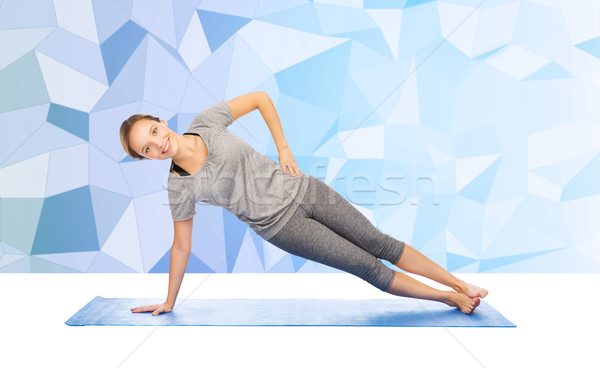 Frau Yoga Seite Planke darstellen Stock foto © dolgachov