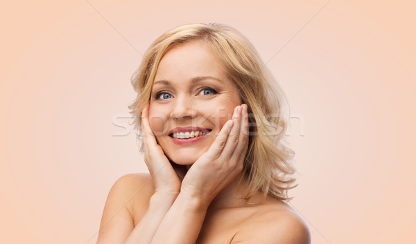 улыбающаяся женщина голый Плечи прикасаться лице красоту Сток-фото © dolgachov