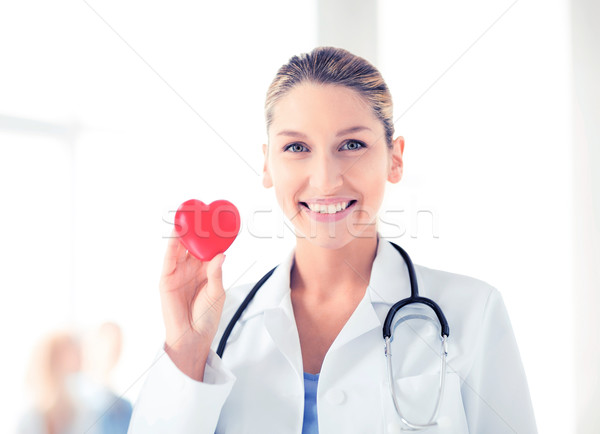 female doctor with heart Stock photo © dolgachov