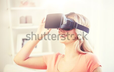 Stock photo: woman in virtual reality headset or 3d glasses