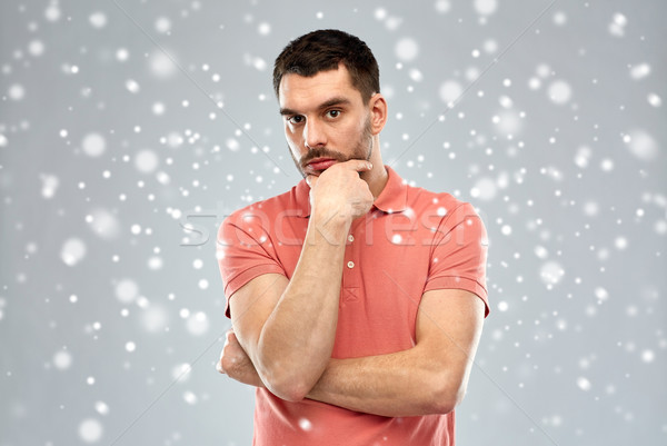 man thinking over snow background Stock photo © dolgachov