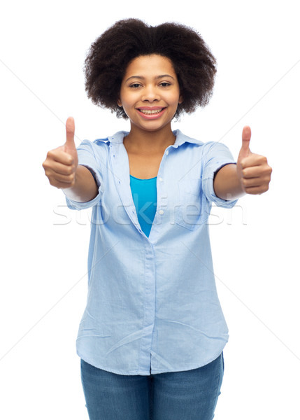 happy african american woman showing thumbs up Stock photo © dolgachov