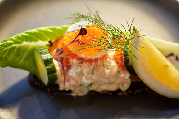 close up of toast skagen with caviar and bread Stock photo © dolgachov