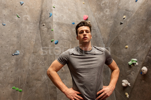 young man exercising at indoor climbing gym Stock photo © dolgachov