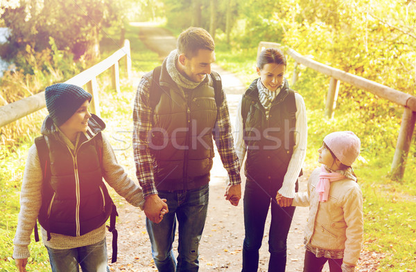 happy family with backpacks hiking Stock photo © dolgachov