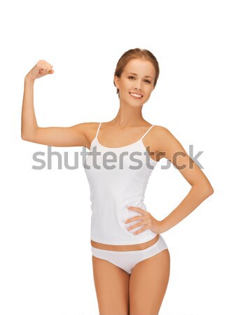 woman in cotton undrewear flexing her biceps Stock photo © dolgachov