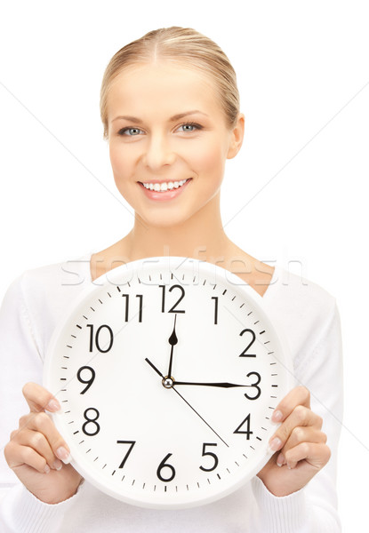 Stock photo: businesswoman with wall clock